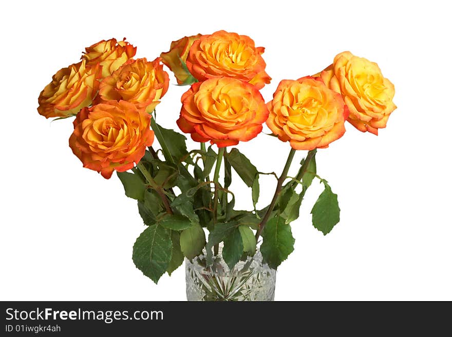 A bouquet of yellow roses in a crystal vase