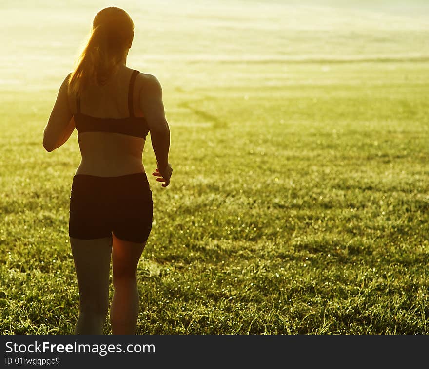 Beautiful young woman runner having a workout session. Beautiful young woman runner having a workout session.