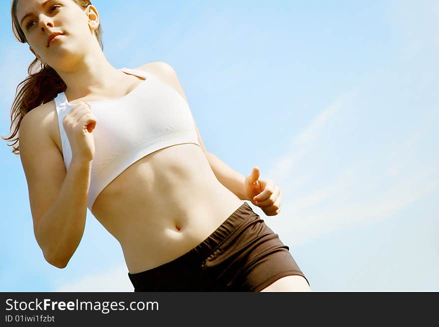 Beautiful young woman runner having a workout session. Beautiful young woman runner having a workout session.