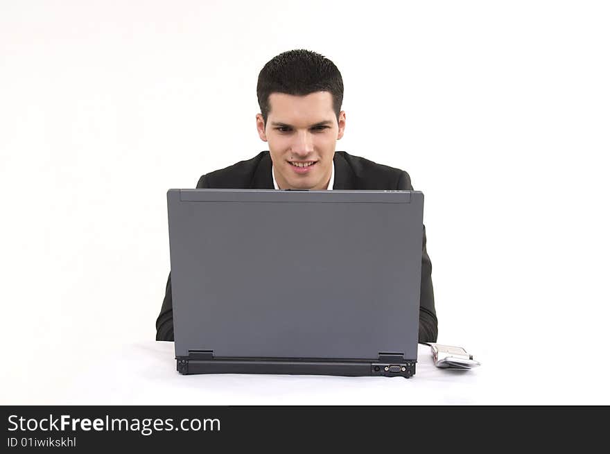 Businessman with lap top computer and phone isolated on white background