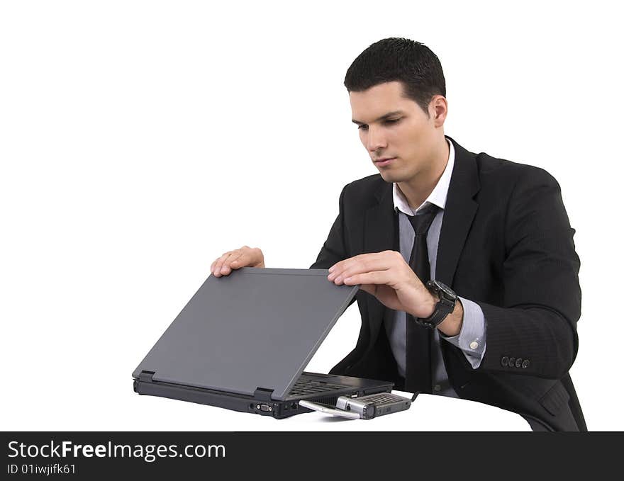 Businessman with lap top computer and phone