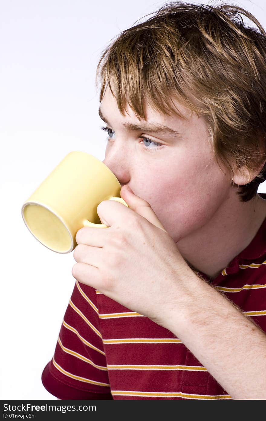 Teenage boy drinking coffee isolated on white background. Teenage boy drinking coffee isolated on white background