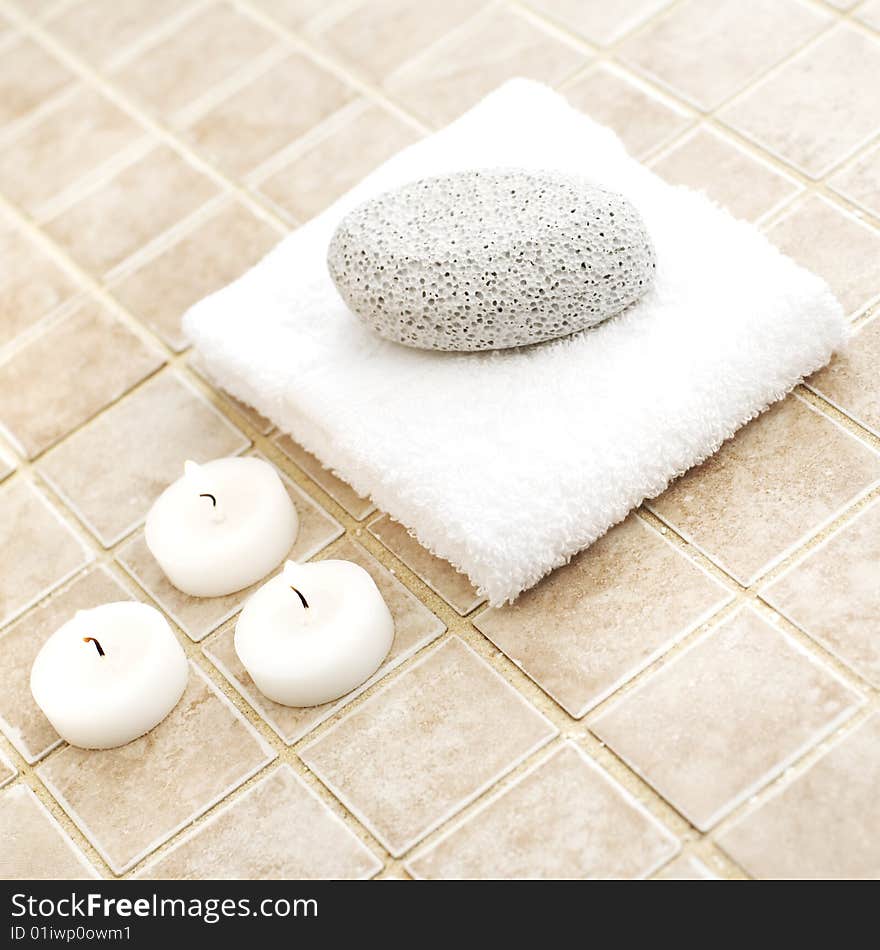 Spa display against a stone tile backdrop.