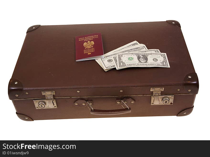 Old suitcase with money and passport isolated on white background