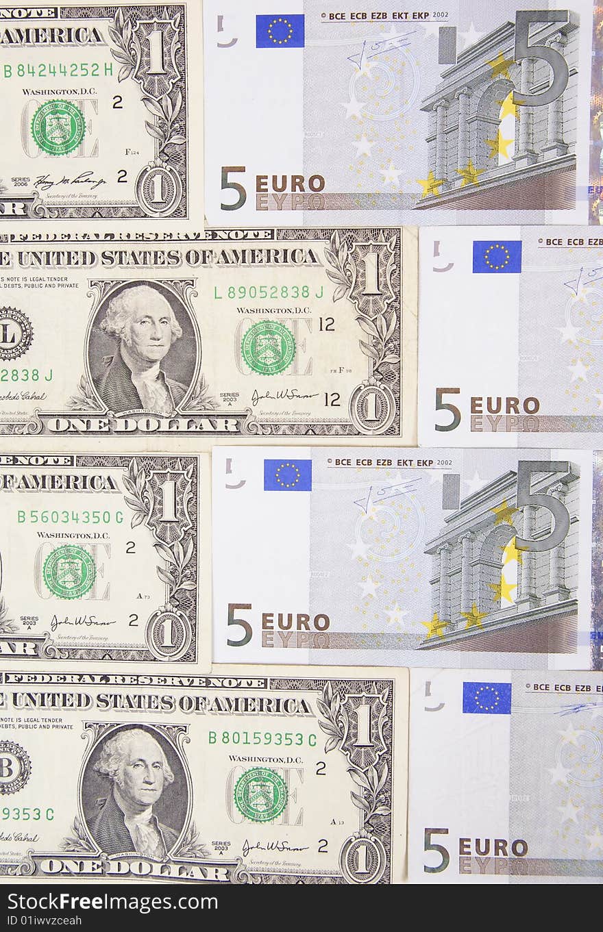 Arranged dollars and euro made as background. Arranged dollars and euro made as background