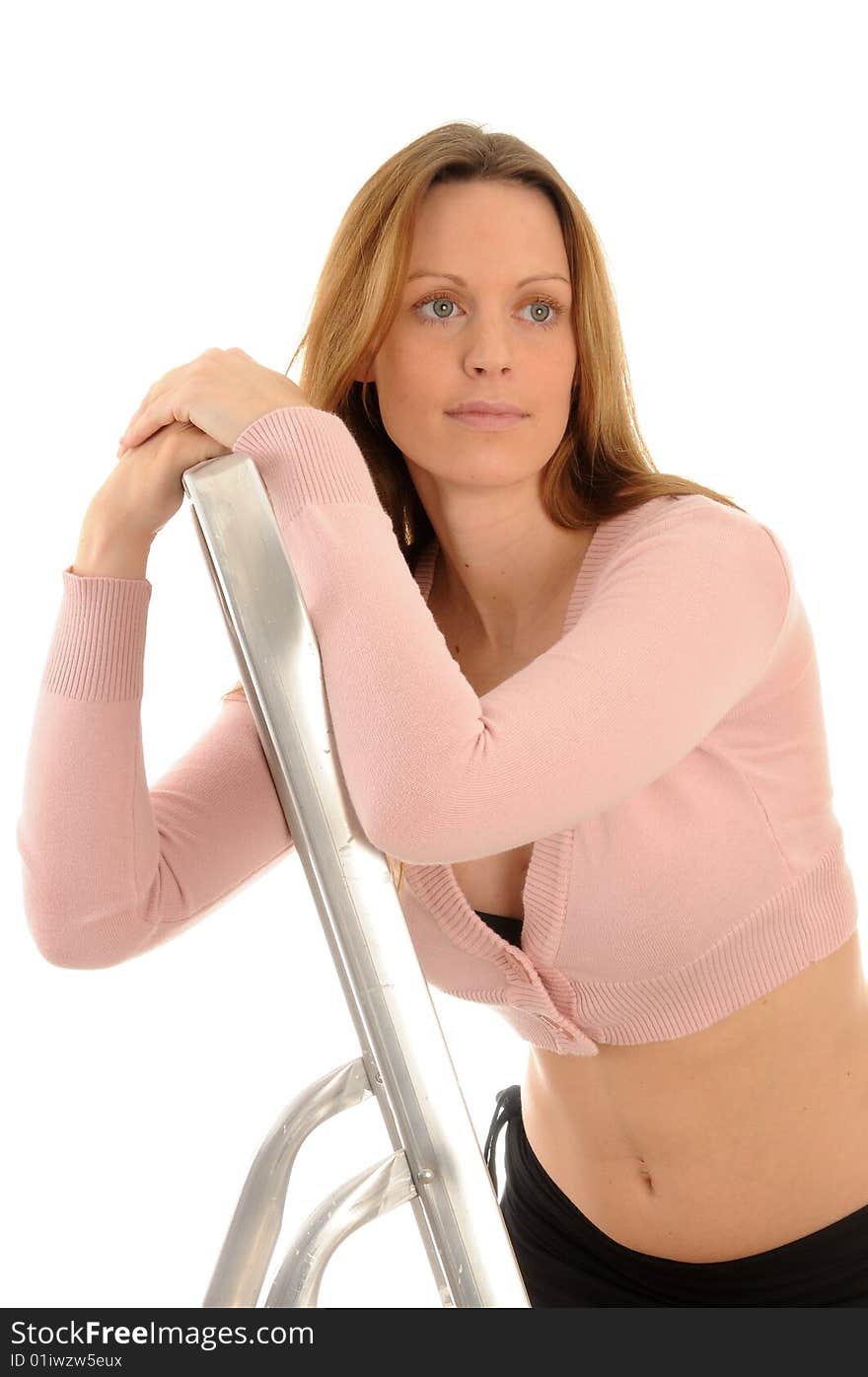 Young woman posing with a ladder. Isolated over white. Young woman posing with a ladder. Isolated over white.