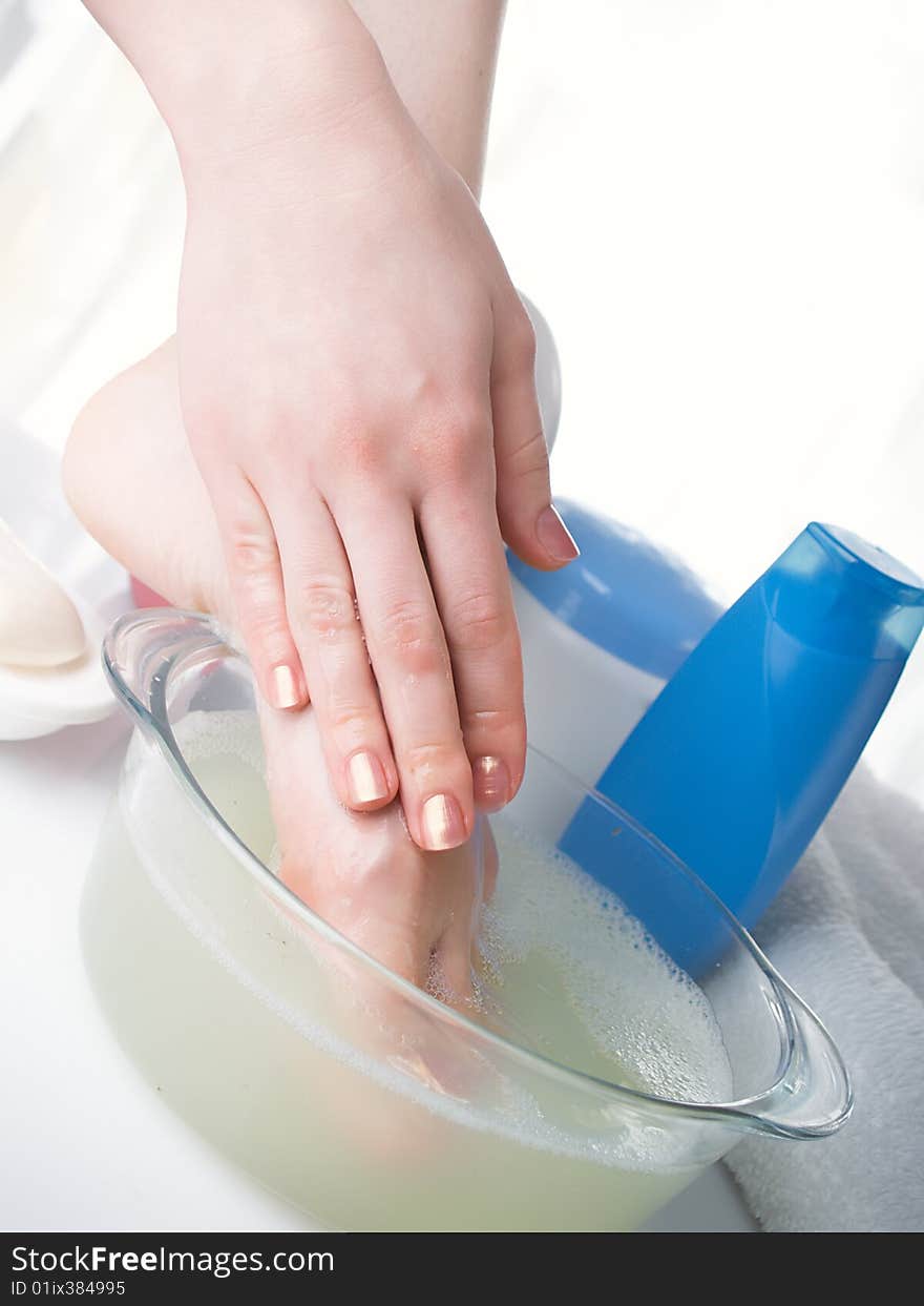 Washing of a female leg in capacity with water