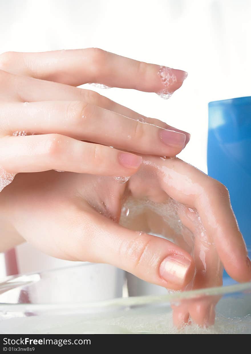 Foam of soap and female hands. Foam of soap and female hands