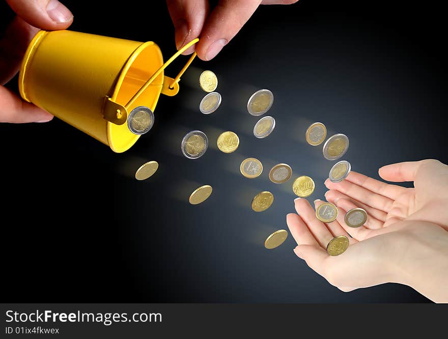 Coins falling to hands over black background. Coins falling to hands over black background.