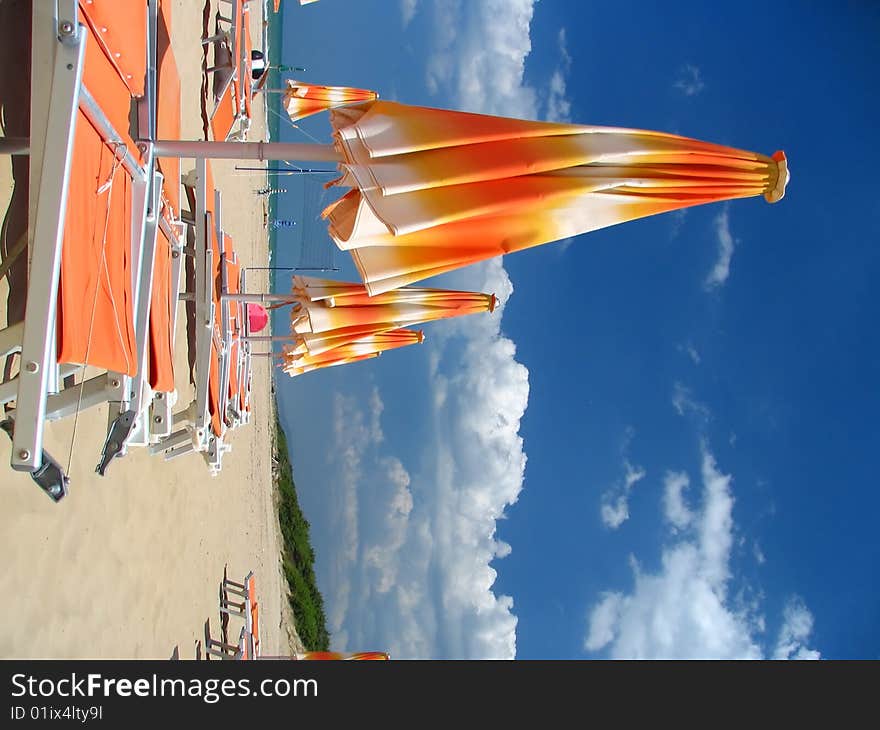 Parasols on the beach are closed