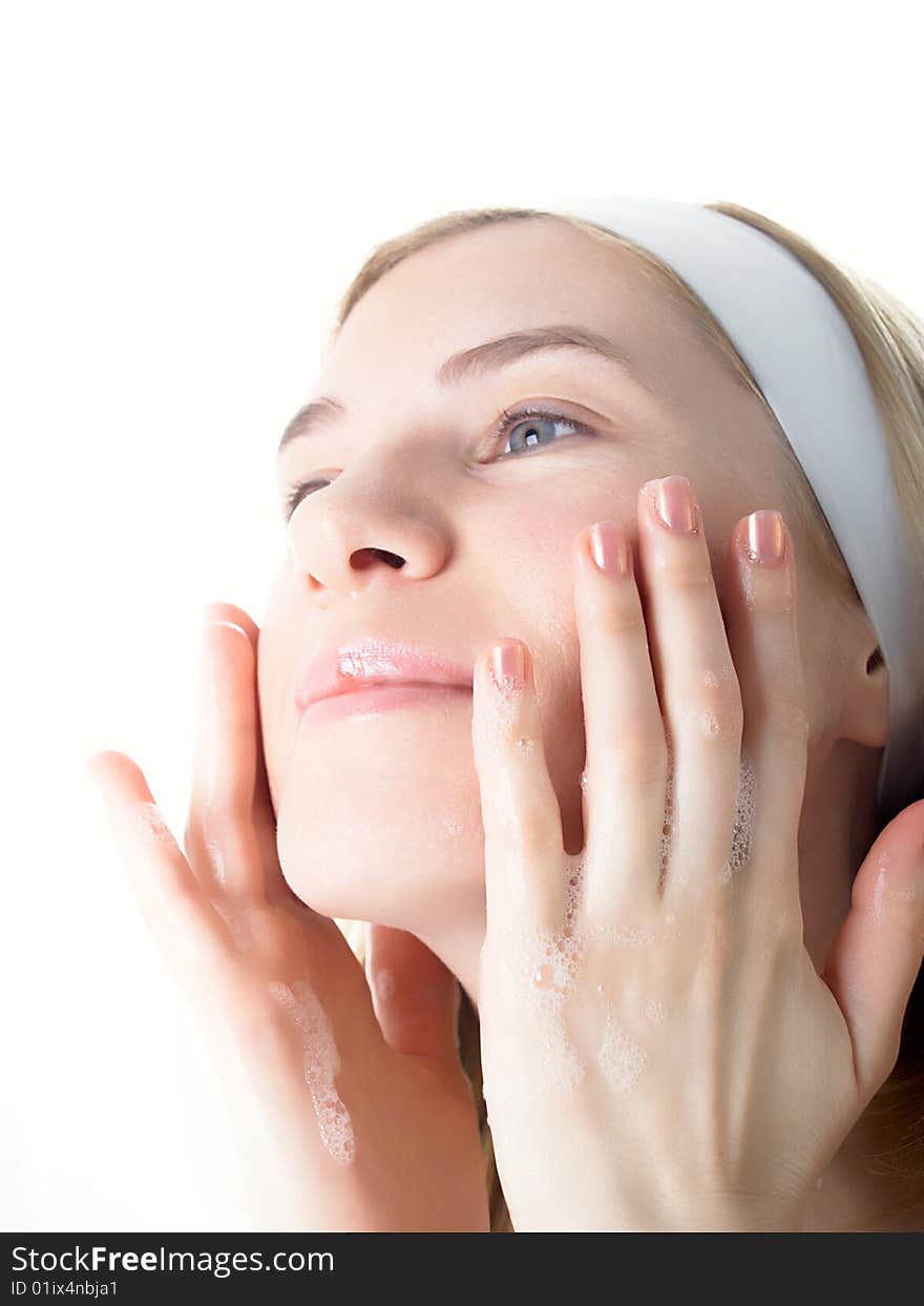 Beautiful woman washing her face