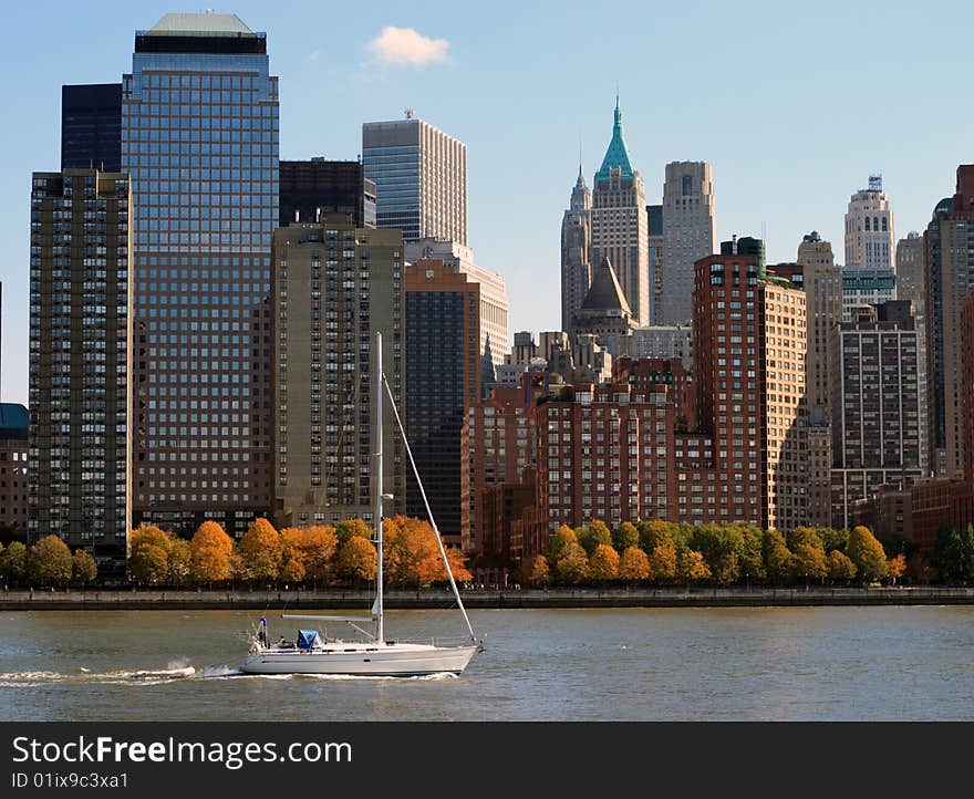 Sail boat cruising with Manhattan at the background