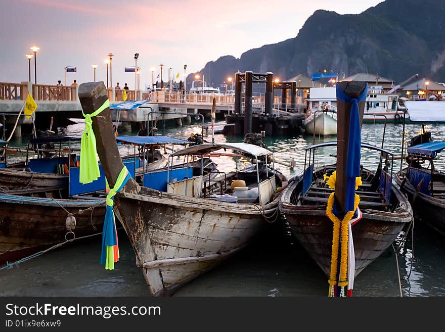 Longtail boats at sunset