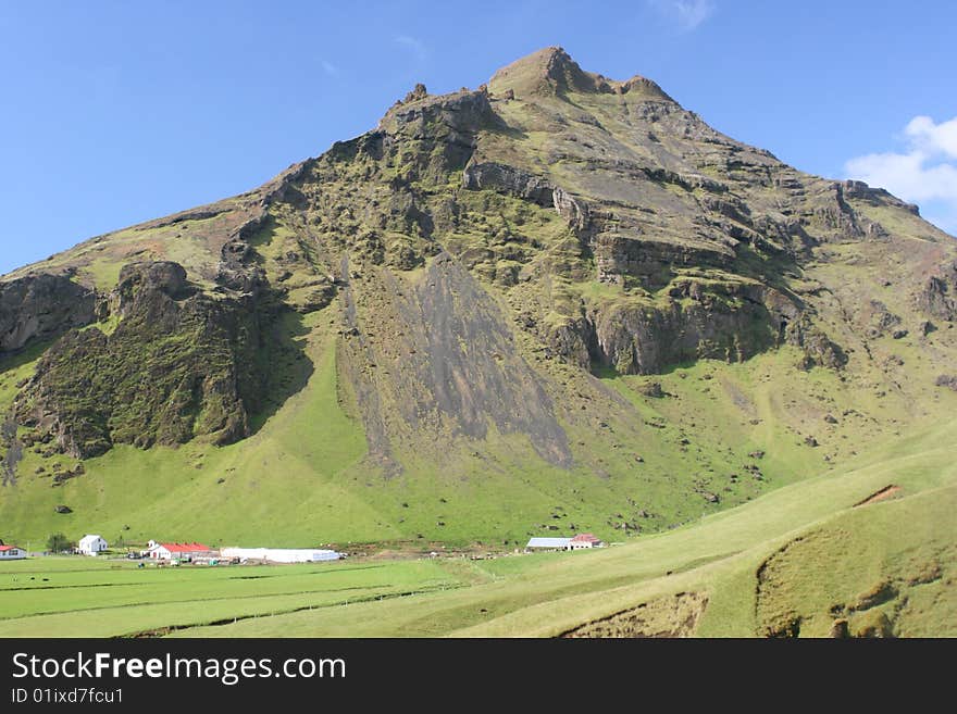 Massive Mountains Behing Clear Blue Sky