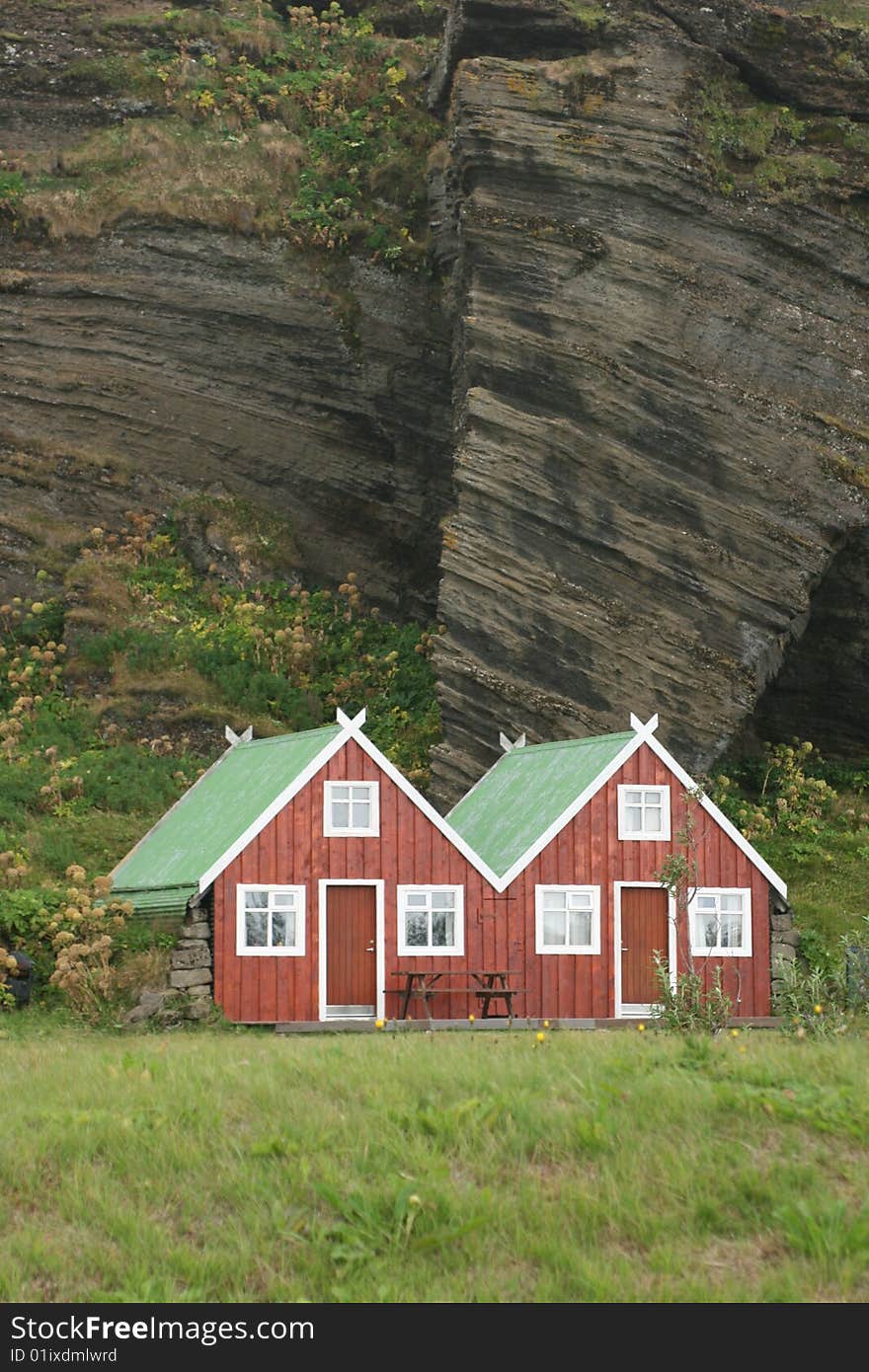 Lodges built in front of a cliff. Lodges built in front of a cliff