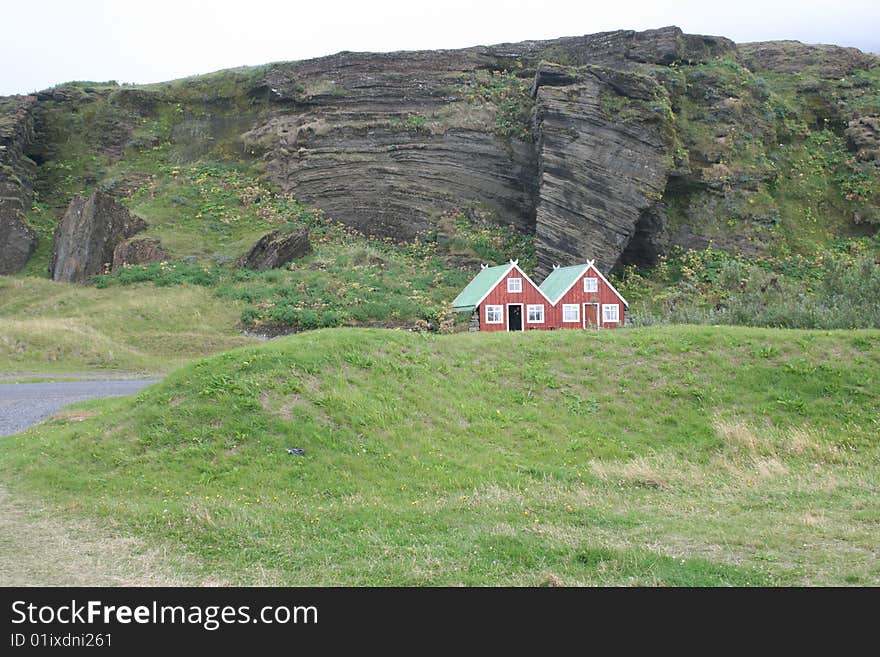 Lodges built in front of a cliff. Lodges built in front of a cliff