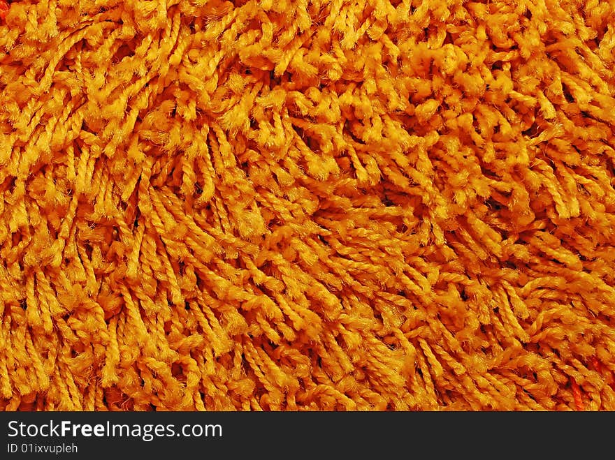 Orange carpet texture, close-up view