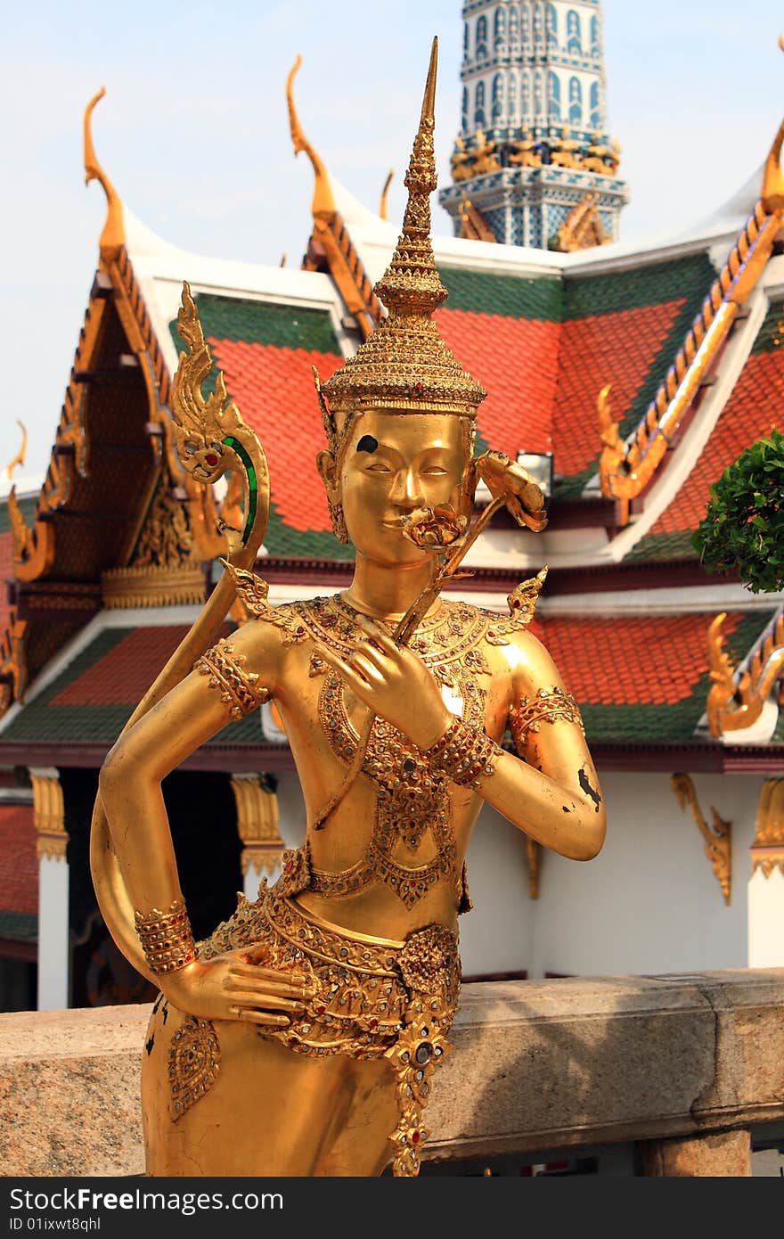 Golden Kinnari statue at Wat Phra Kaew in royal palace, Bangkok, Thailand. Golden Kinnari statue at Wat Phra Kaew in royal palace, Bangkok, Thailand.