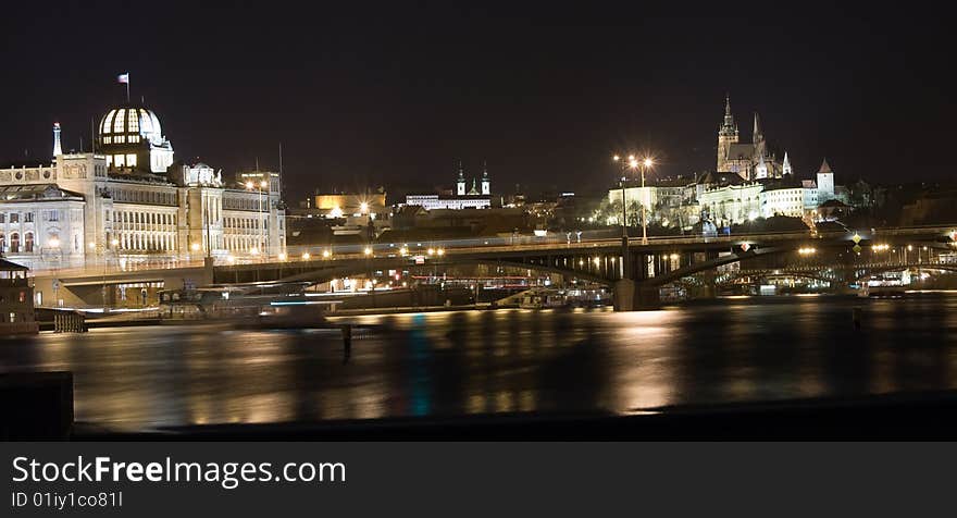 Night panorama of Prague castle and New Town with reflection in Vltava river. Night panorama of Prague castle and New Town with reflection in Vltava river.