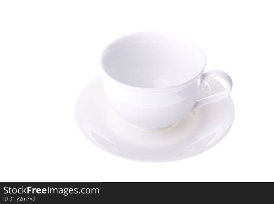 Empty white cup with saucer