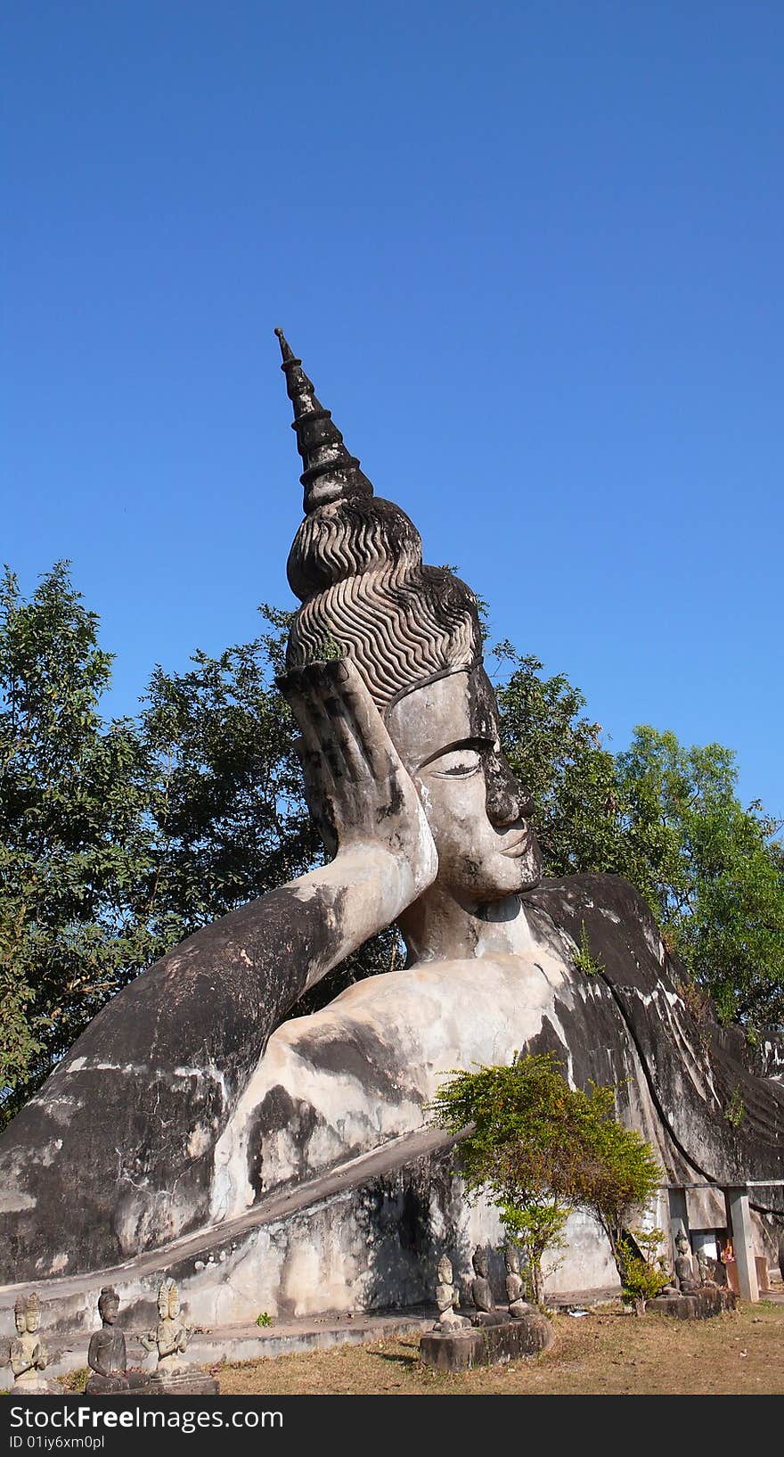 A Stone sculpture of a sleeping buddha in the Laos