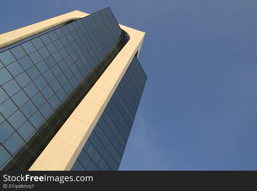 A modern building made of glass in Sesto San Giovanni, Italy. A modern building made of glass in Sesto San Giovanni, Italy