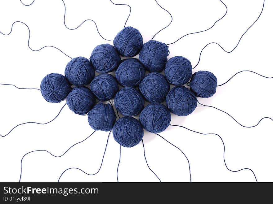 Blue threads and clews  isolated on a white background. Blue threads and clews  isolated on a white background