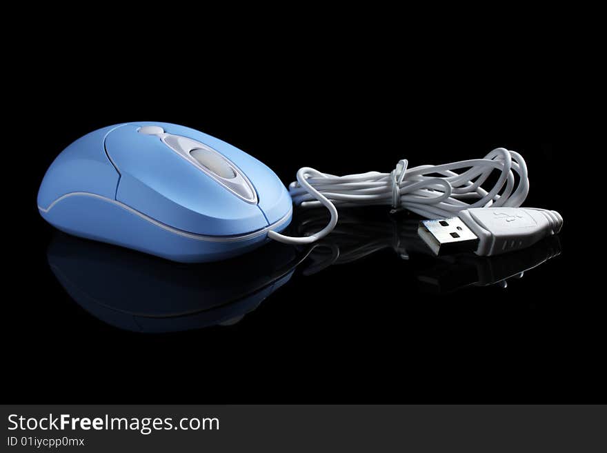 Close up of USB optical mouse isolated on black background. Close up of USB optical mouse isolated on black background.