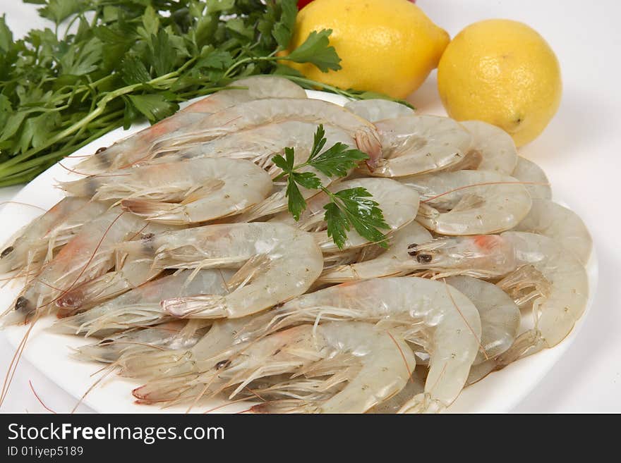 Shrimps on white bowl with lemon