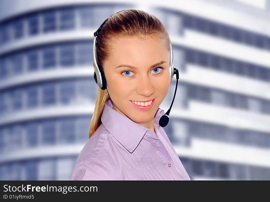 Woman wearing headset in office;could be reception