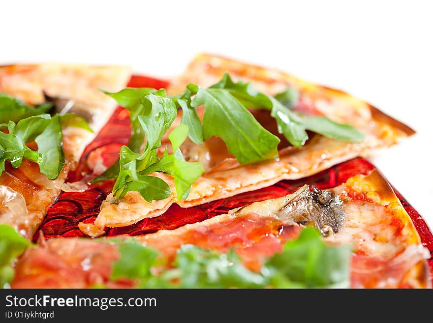 Sliced tasty pizza. Isolated over white