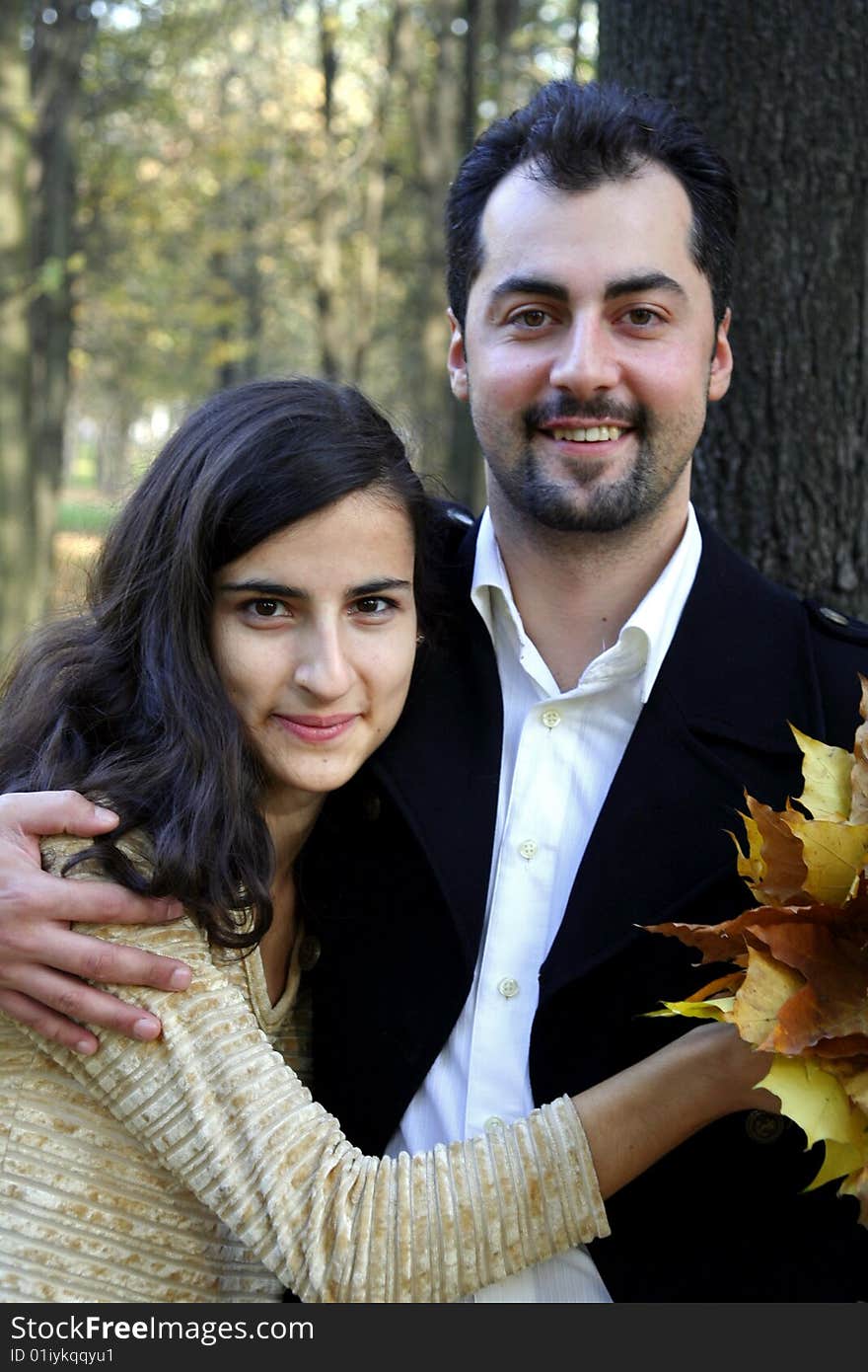 Young man and woman in the autumn forest. Young man and woman in the autumn forest