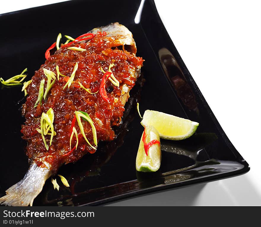 Thai Dishes - Grilled Dorado with Ginger Sauce. Isolated on White Background