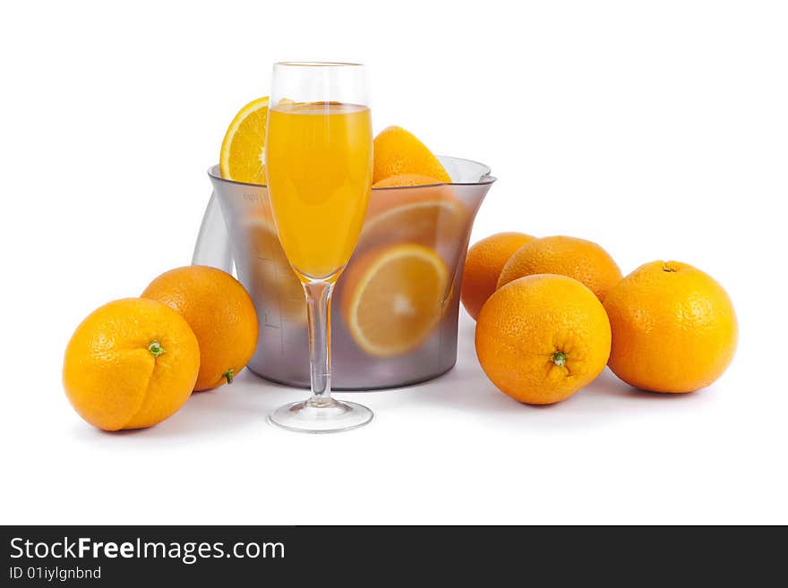 Oranges and glass of juice isolated on white. Oranges and glass of juice isolated on white