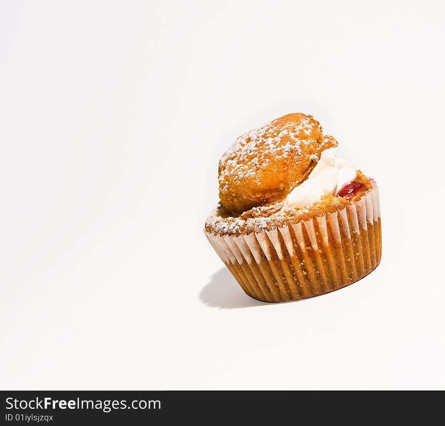 Small cream bun with freah cream and jam. Small cream bun with freah cream and jam