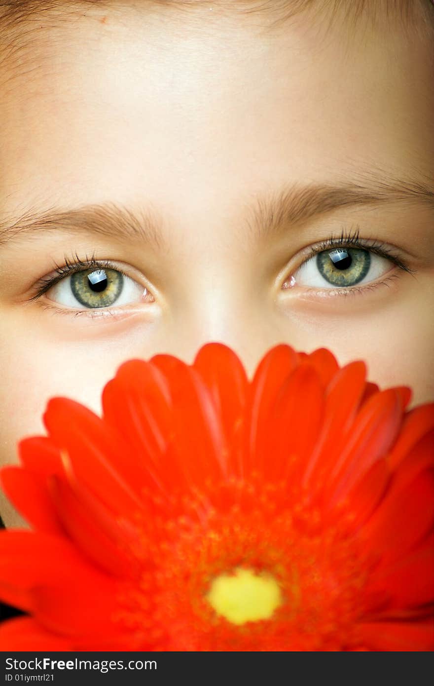 Smiling beautiful young girl with a flower at spring. Smiling beautiful young girl with a flower at spring