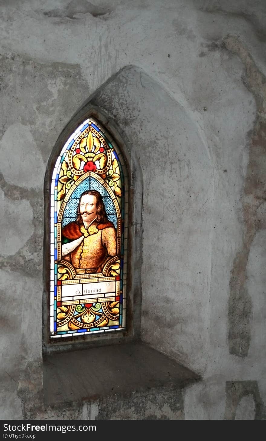 A beautiful, old, vivid stained-glass window from an ancient castle in Romania.