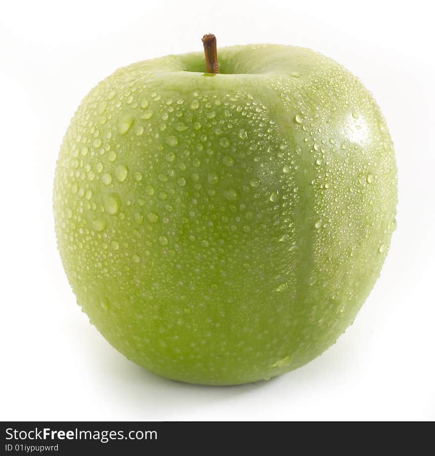 Wet green apple fruit on table