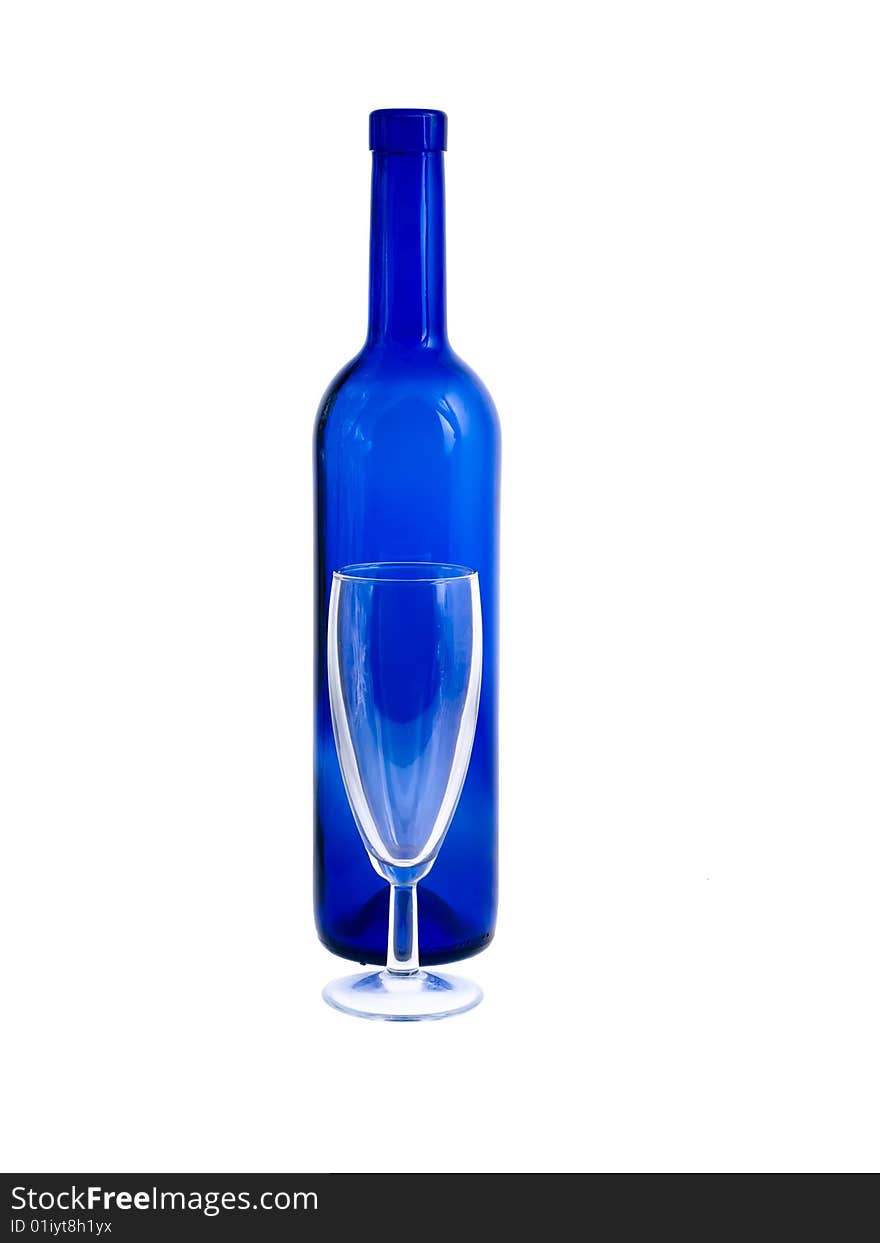 An empty bottle and wineglass isolated on white