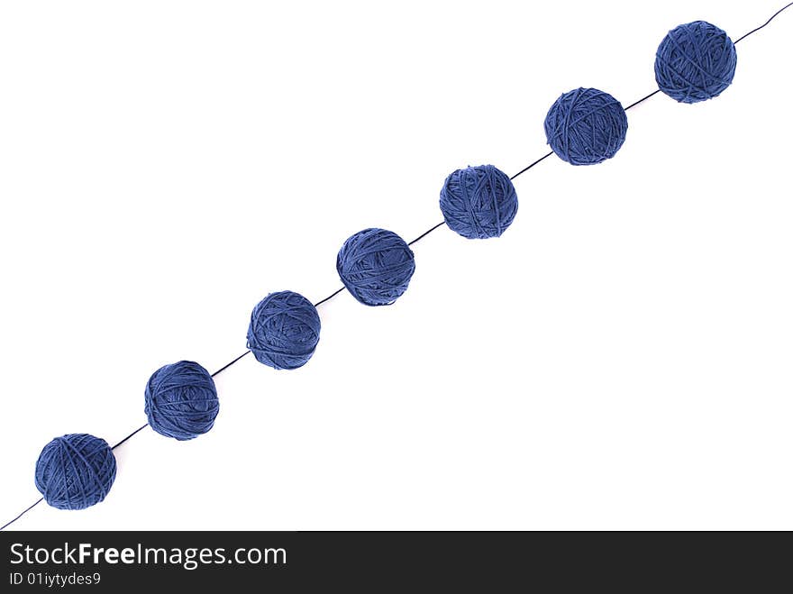 Blue thread and clews  isolated on a white background. Blue thread and clews  isolated on a white background