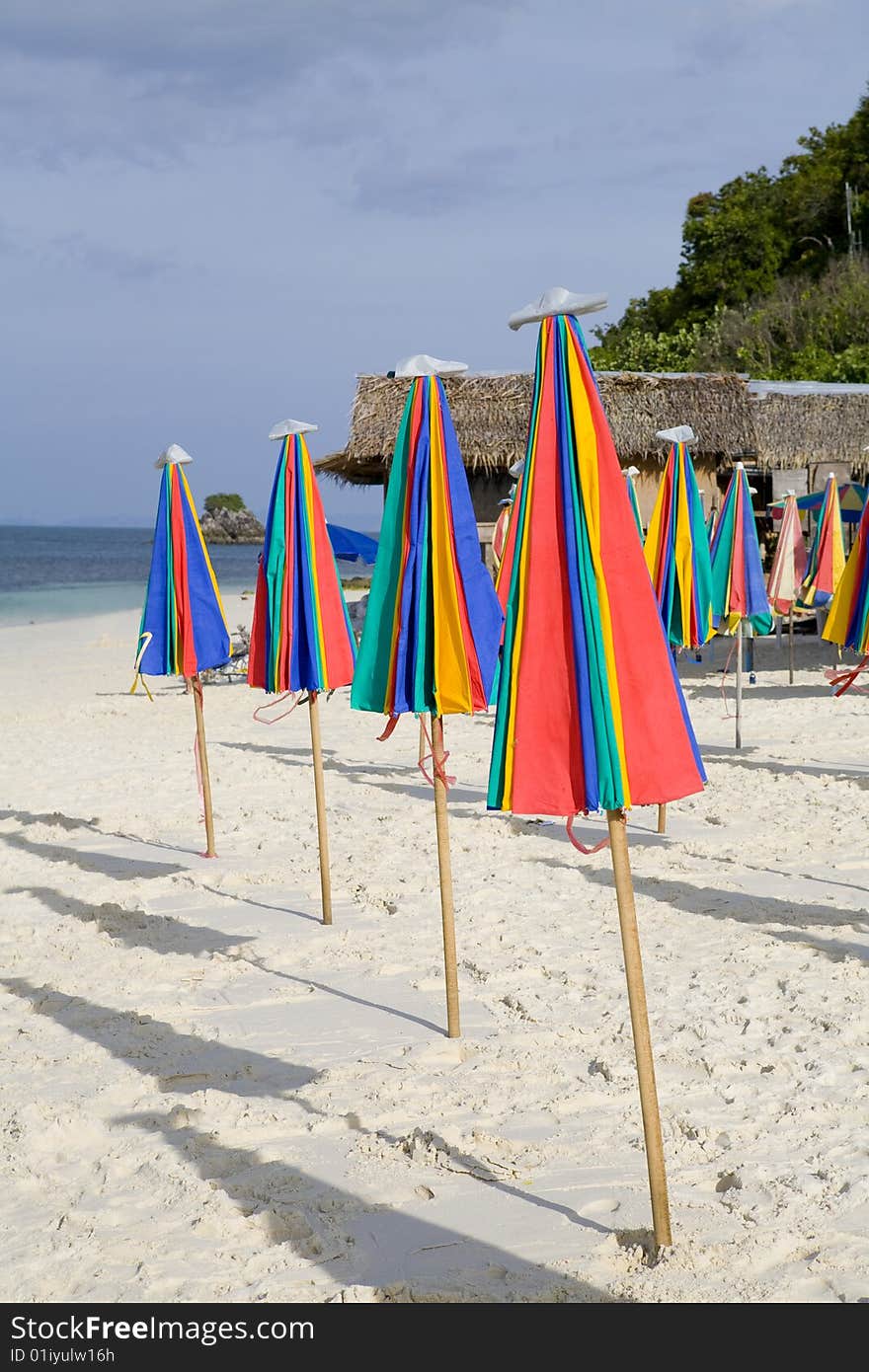 A row or colorful umbrellas on the beach