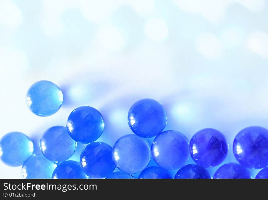 Blue glass balls on a white background