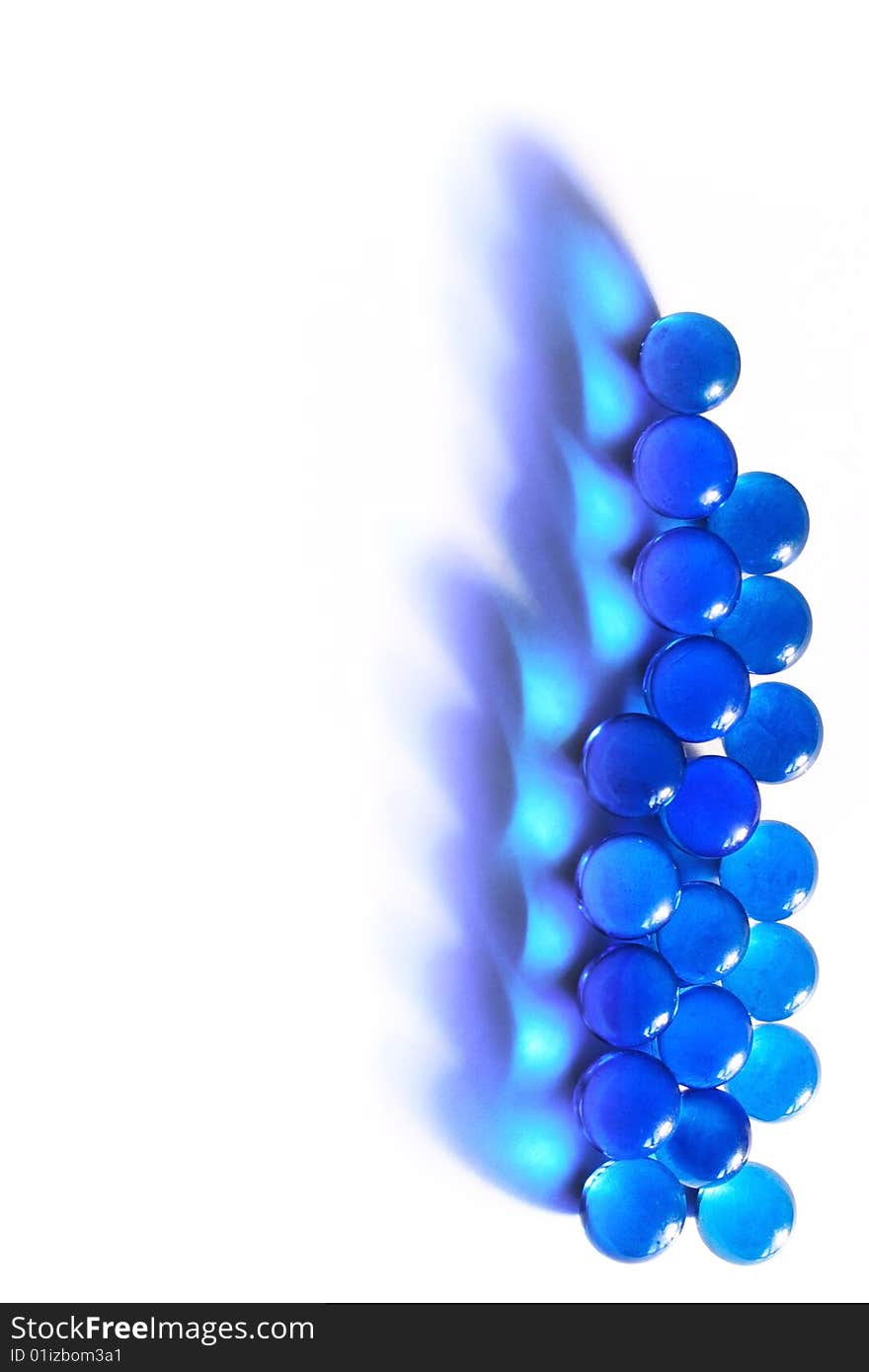 Blue glass beads on a white background