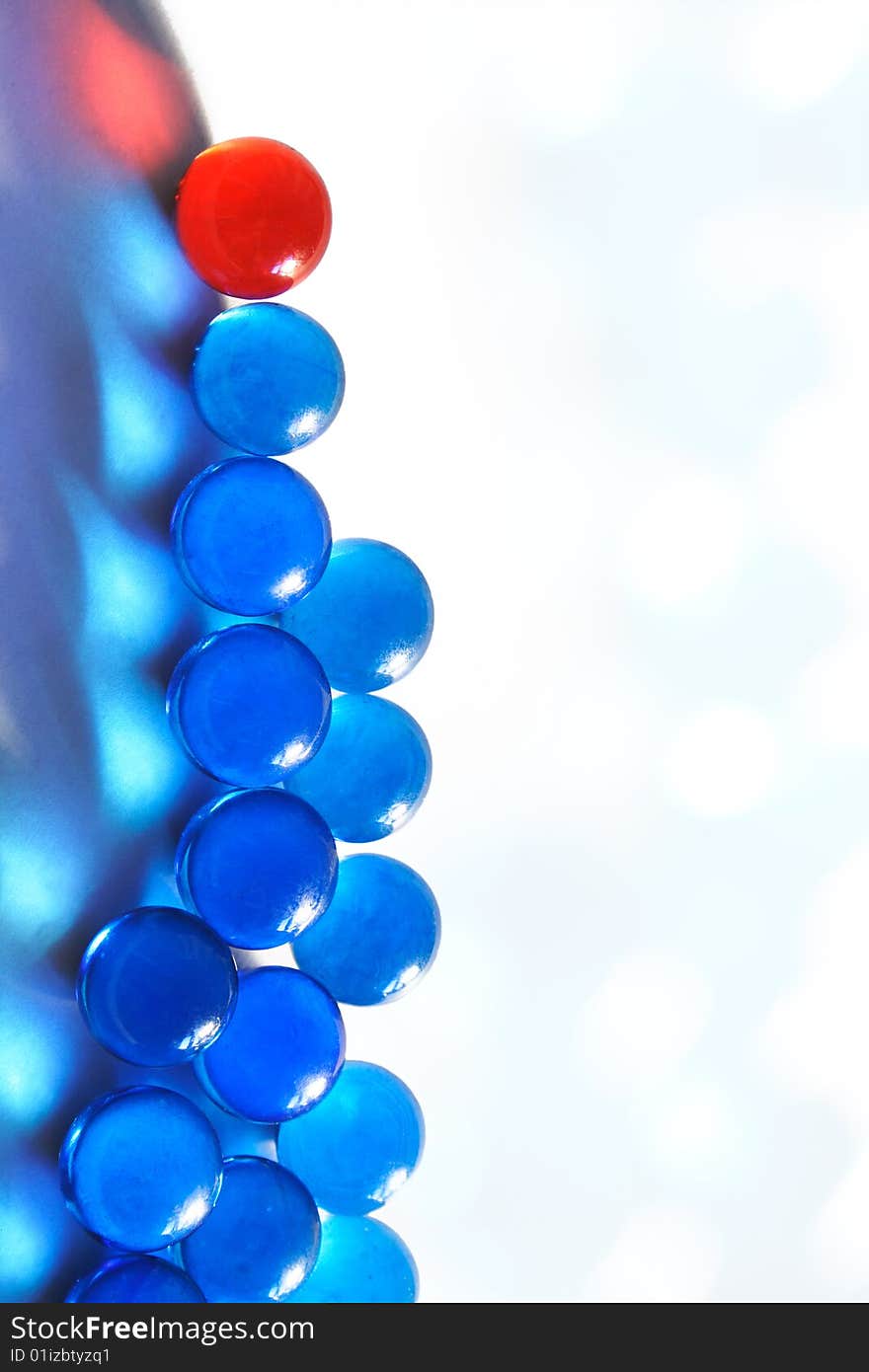 Blue glass beads on a white background