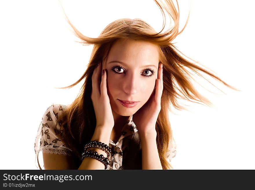 Portrait of a beautiful young woman with hair flying