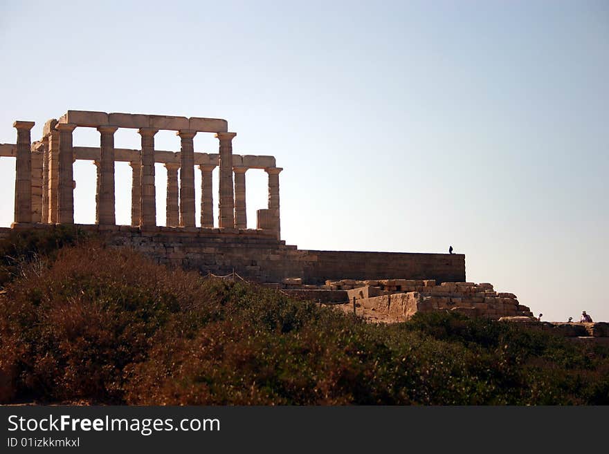 The Temple of Poseidon south of Athens, Greece on a cliff above the sea. The Temple of Poseidon south of Athens, Greece on a cliff above the sea.