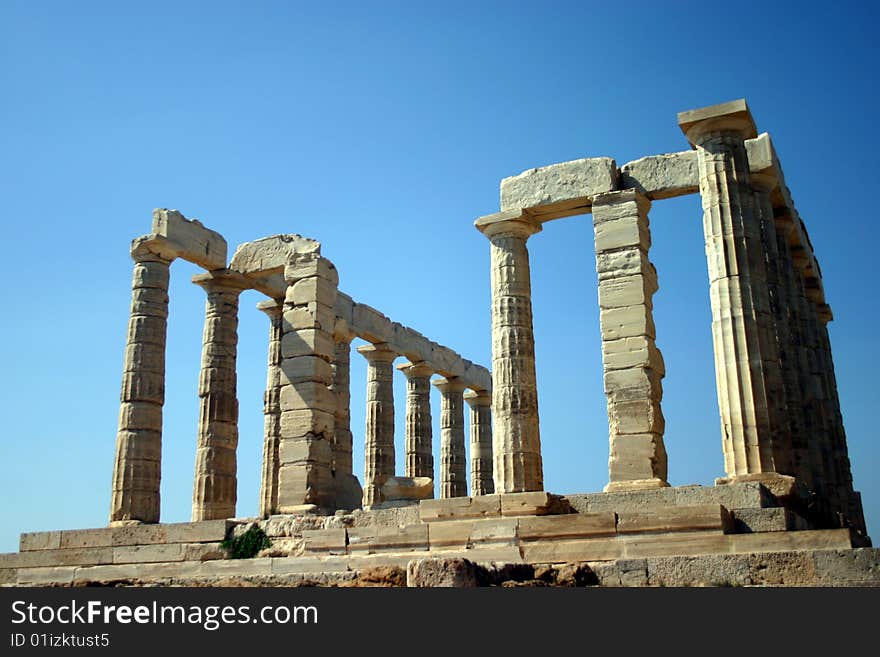 The Temple of Poseidon south of Athens, Greece on a cliff above the sea. The Temple of Poseidon south of Athens, Greece on a cliff above the sea.