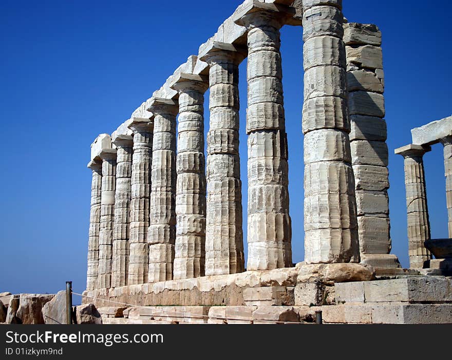 The Temple of Poseidon south of Athens, Greece on a cliff above the sea. The Temple of Poseidon south of Athens, Greece on a cliff above the sea.