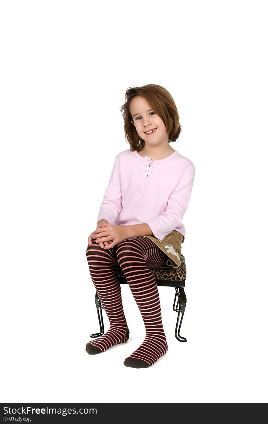 Young Girl In Funky Outfit Sitting On Stool