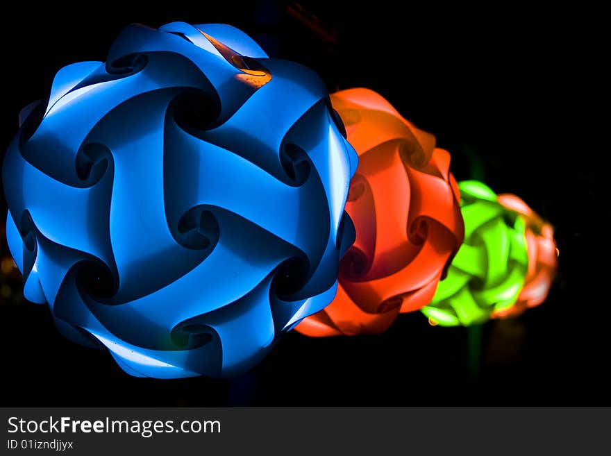 Paper multicolor lanterns at night on black background. Paper multicolor lanterns at night on black background